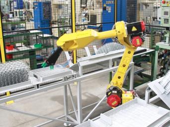 Inserting valves into the press by a robot Inserting valves into the press by a robot