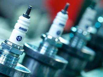 Laser lettering of spark plug cases Laser lettering of spark plug cases