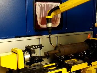 Einspannung für das Schweißen der Zylinderachsen. Robotisches Schweißen mit FANUC und Kemppi. Automatisierung des Schweißens. Einspannung für das Schweißen der Zylinderachsen. Robotisches Schweißen mit FANUC und Kemppi. Automatisierung des Schweißens.